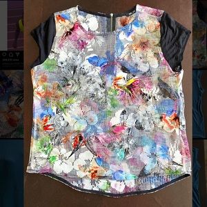 Women’s mesh short sleeved top, size Medium.